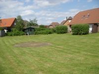 Rasenfläche mit integrierter Sandkuhle