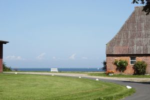Bild 3: Kutscherhaus Gut Ohrfeld-Einzellage,Meerblick vom Hof, Sauna und Kaminofen