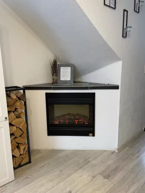 Ein Elektro-Kamin sorgt für pure Gemütlichkeit am Abend nach einem erlebnisreichen Tag