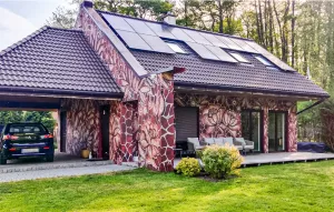 Bild 1: P104a Ferienhaus Mikosch mit eingezäunten Garten fußläufig zum Wasser